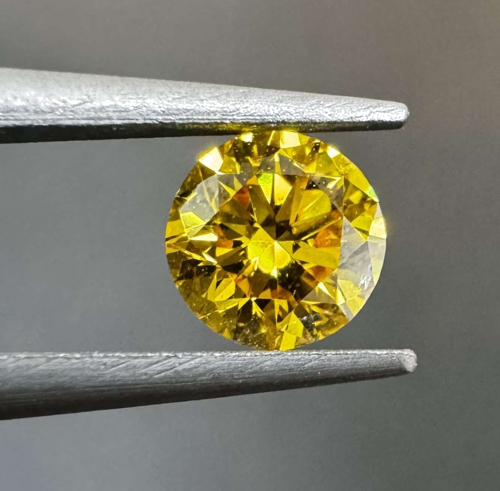 0.3 carat Fancy Vivid Orangey Yellow-SI2 GD cut Natūralus Round Deimantas (1)