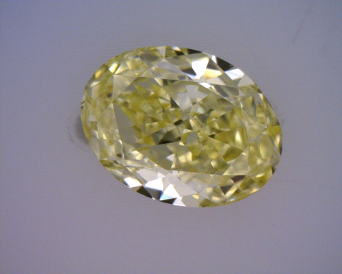 0.58 carat Fancy Intense  Yellow-SI1 Natūralus Oval Deimantas (1)
