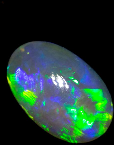 0.42 carat MULTI_COLOR CABOCHON cut Oval Opal (1)