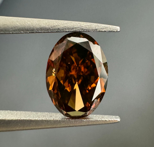 0.56 carat Fancy Dark Orange Brown-VS2 Natūralus Oval Deimantas (1)