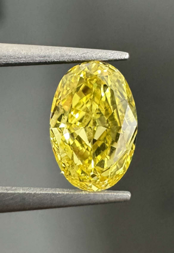 0.47 carat Fancy Vivid Yellow-VS2 Natūralus Oval Deimantas (1)