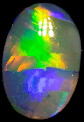 0.63 carat MULTI_COLOR CABOCHON cut Oval Opal (1)