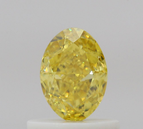 0.63 carat Fancy Vivid Yellow-VS2 Natūralus Oval Deimantas (1)