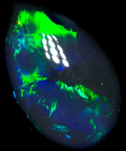 0.65 carat MULTI_COLOR CABOCHON cut Oval Opal (1)
