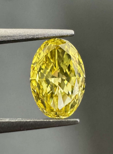 0.43 carat Fancy Vivid Yellow-VS1 Natūralus Oval Deimantas (1)