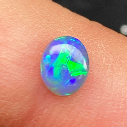 0.55 carat BLACK Oval Opal (1)