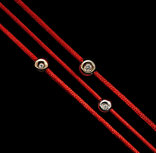 Red thread bracelet with a gold bead and ruby (3)